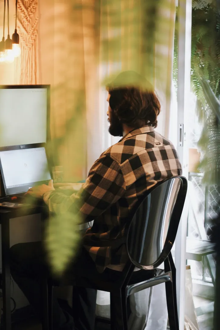 Working on a laptop at a home desk